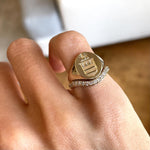 14k solid yellow gold signet ring with bespoke engraving. Custom family crest design.